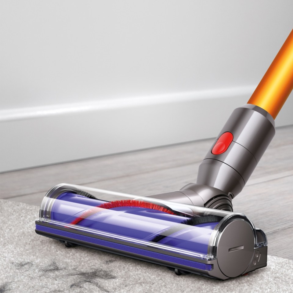 a dyson vacuum cleaner is being used to clean a carpet