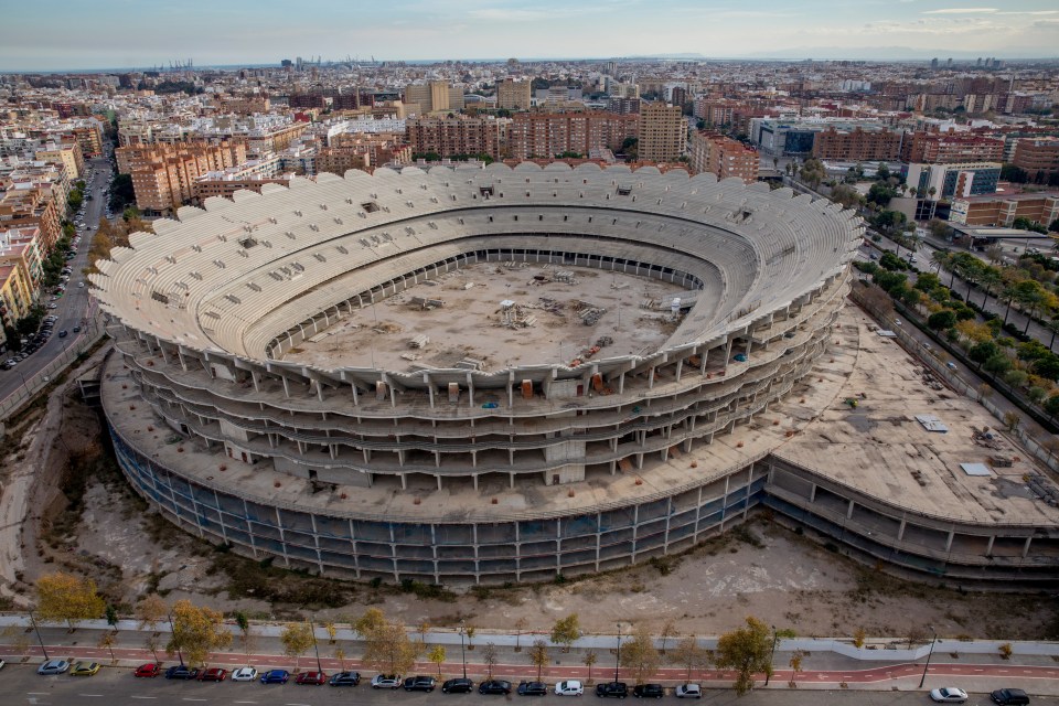an aerial view of an empty stadium in a city
