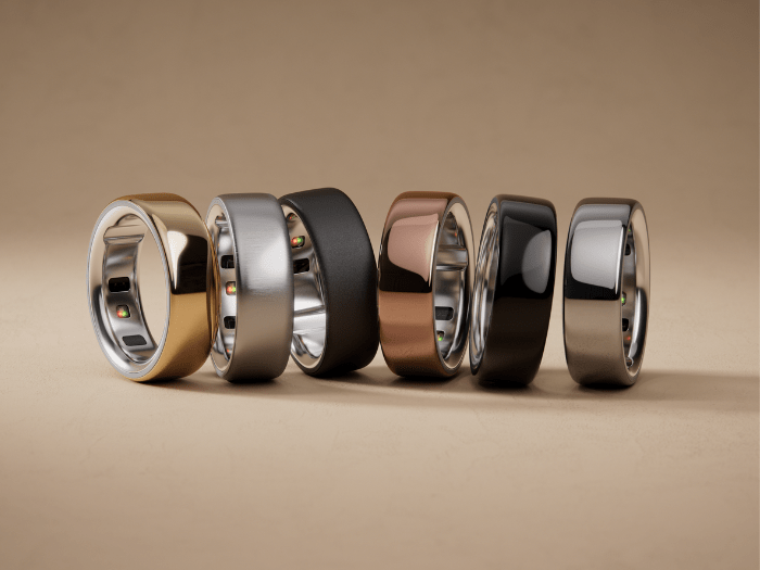 a row of rings of different colors are lined up in a row