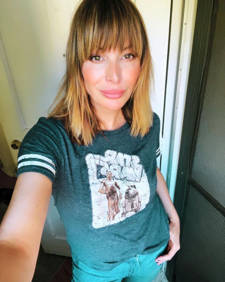 a woman is wearing a star wars t-shirt