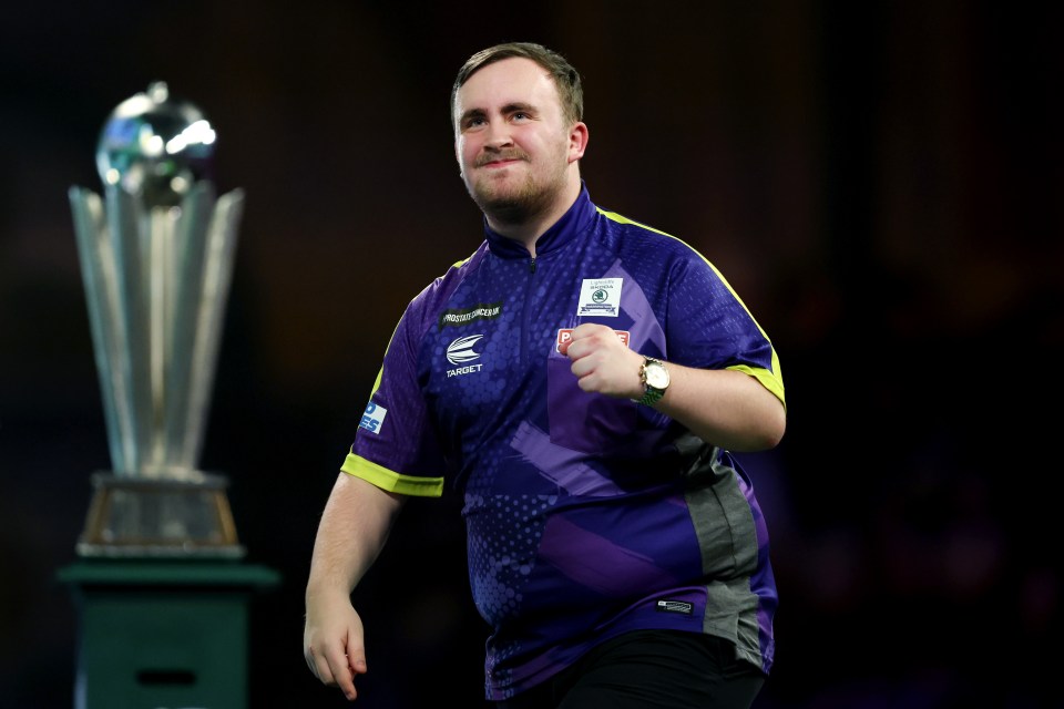 Luke Littler celebrates after the PDC World Darts Championship final.