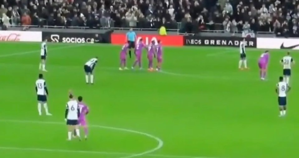 Soccer players on a field during a game.