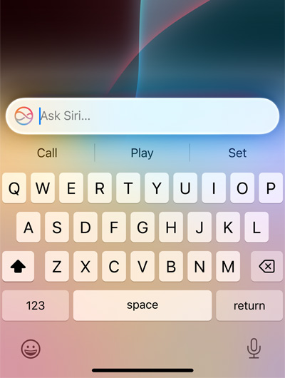iPhone screen showing Siri search bar and keyboard.