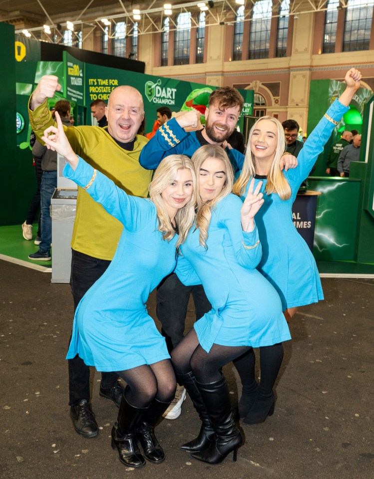 Group of people in Star Trek costumes at a darts event.