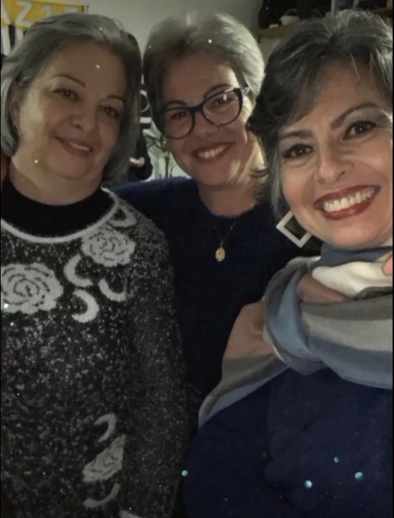 Three women posing for a photo.