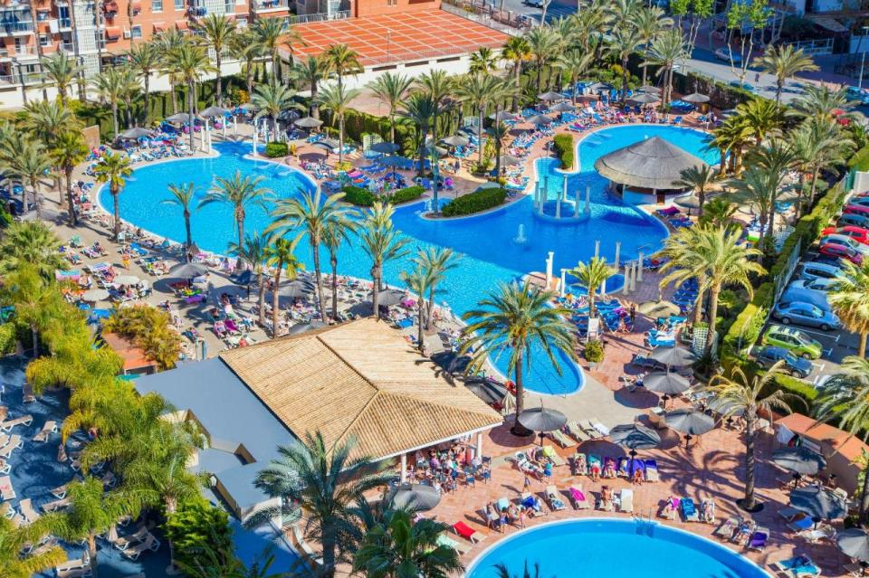 Aerial view of a resort pool area in Benidorm, Spain.