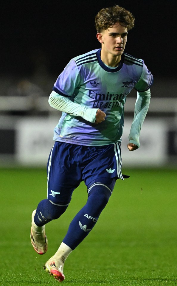 Max Dowman of Arsenal U18 running on a soccer field.
