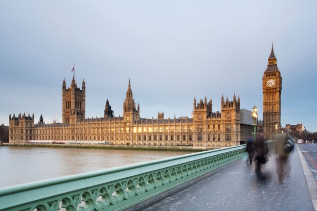 Big Ben and the Houses of Parliament under a cloudy sky.