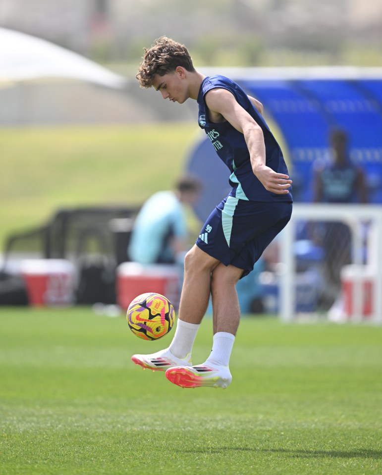 Max Dowman of Arsenal juggling a soccer ball during a training session.