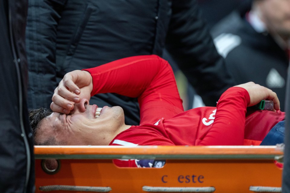 Injured Lisandro Martinez being carried off the field on a stretcher.