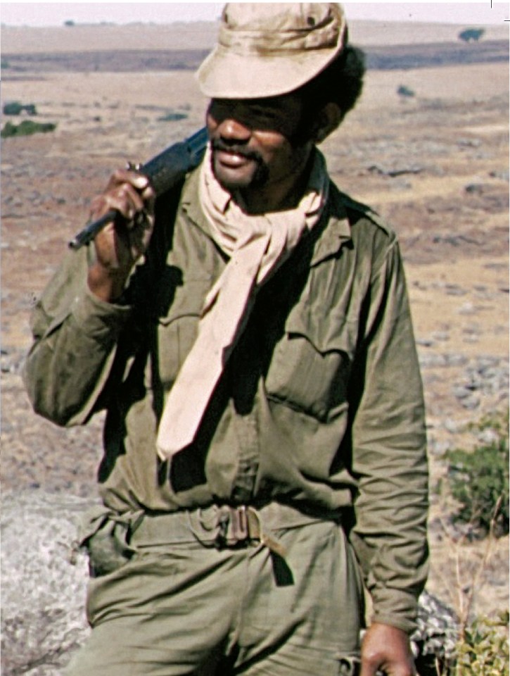 Photo of a soldier carrying a rifle.