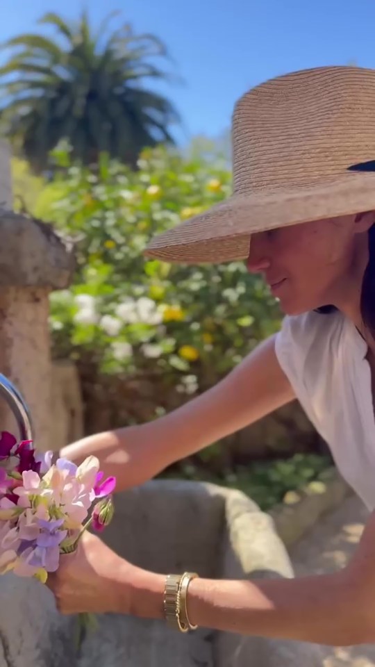 Meghan Markle arranging flowers.