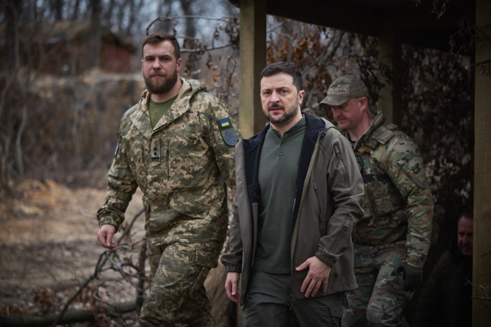 This handout photograph taken and released by Ukrainian Presidential Press Service on March 22, 2025, shows Ukraine's President Volodymyr Zelensky (C) during a meeting with officers of the Ukrainian Armed Forces at an undisclosed location in the Donetsk region, amid the Russian invasion of Ukraine. During working visit to the Donetsk region President of Ukraine Volodymyr Zelenskyy visited the command post of the Pokrovsk tactical group and the command post of the 59th separate assault brigade of unmanned systems named after Yakiv Handziuk. (Photo by Handout / UKRAINIAN PRESIDENTIAL PRESS SERVICE / AFP) / RESTRICTED TO EDITORIAL USE - MANDATORY CREDIT "AFP PHOTO / Ukrainian Presidential Press Service" - NO MARKETING NO ADVERTISING CAMPAIGNS - DISTRIBUTED AS A SERVICE TO CLIENTS (Photo by HANDOUT/UKRAINIAN PRESIDENTIAL PRESS SERVICE/AFP via Getty Images)
