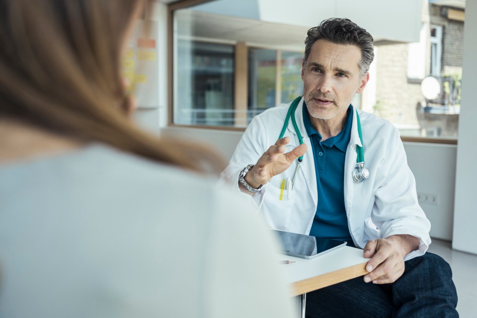 Doctor explaining something to a patient.