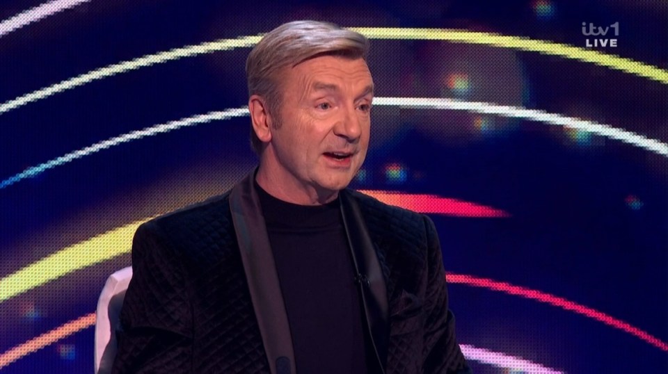 Screenshot of a man speaking on a television show.