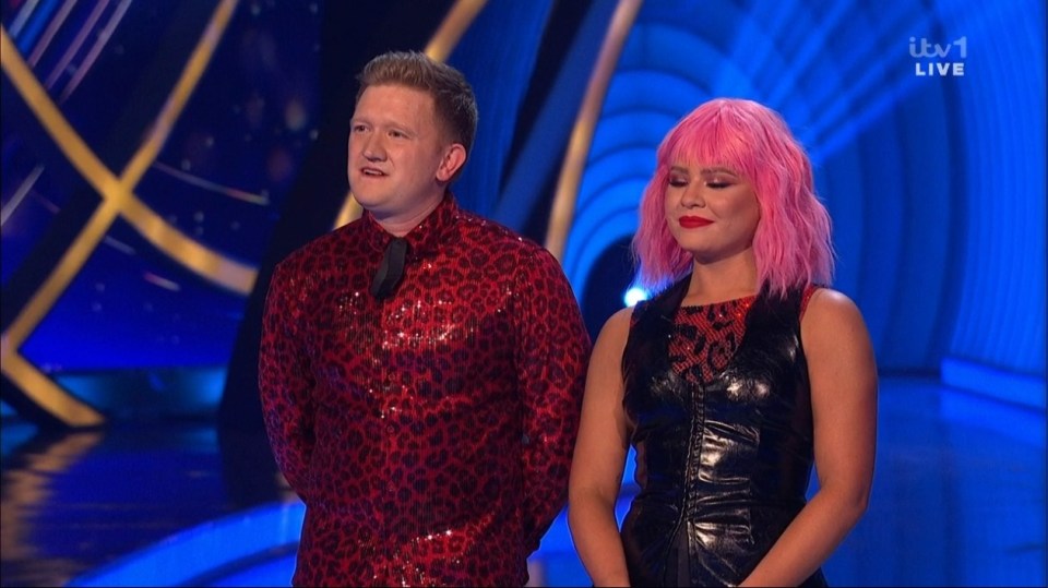Screenshot of two people on a game show.