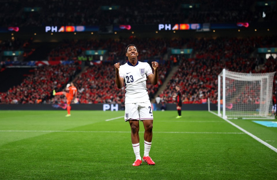 Myles Lewis-Skelly of England scores during a soccer match.