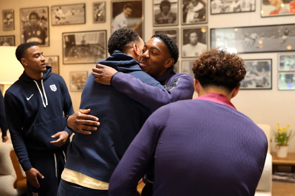 Two young men embracing.
