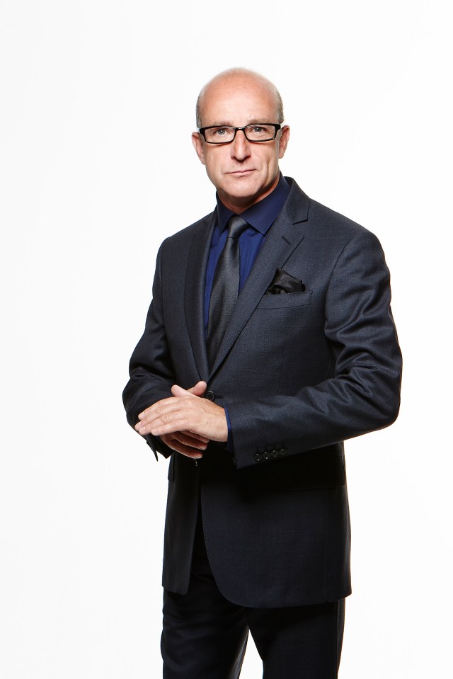 Portrait of Paul McKenna in a suit.