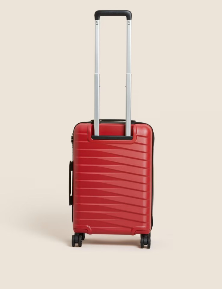 Red carry-on suitcase.