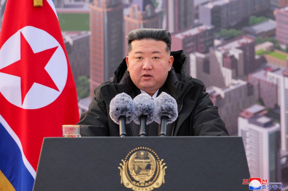 Kim Jong Un speaking at a podium.
