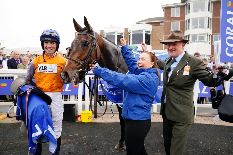 Jockeys and horses racing at Ayr Racecourse.