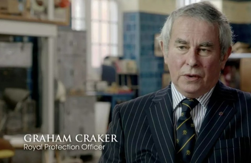 Graham Craker, Royal Protection Officer, in a pinstripe suit.
