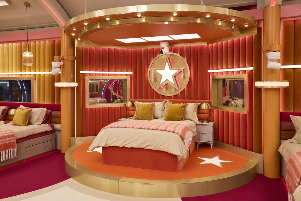 Bedroom set on a raised platform in a "Celebrity Big Brother" house.