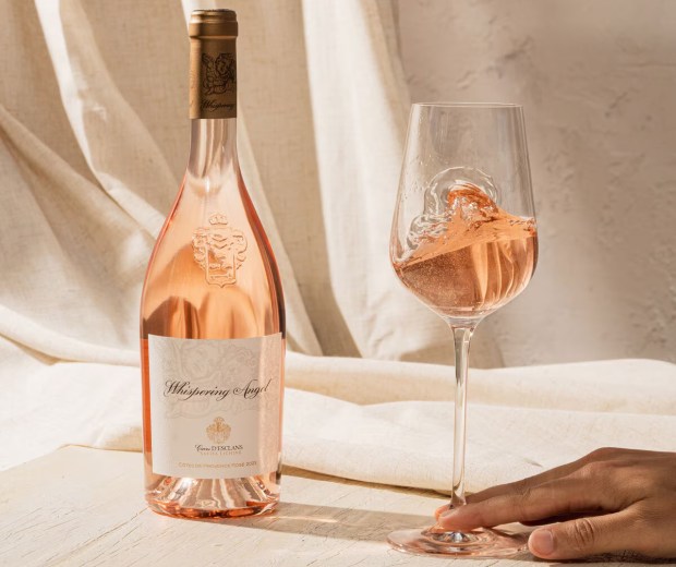 Bottle of Whispering Angel rosé wine and a glass of the wine.