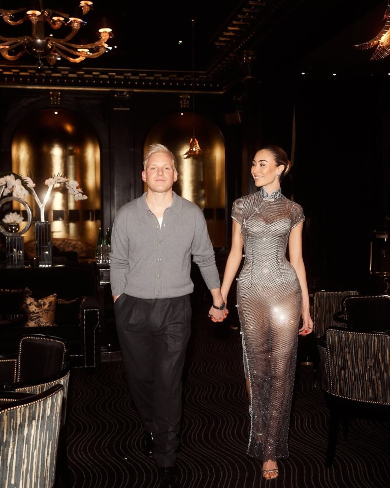Jamie Laing and Sophie Habboo holding hands.