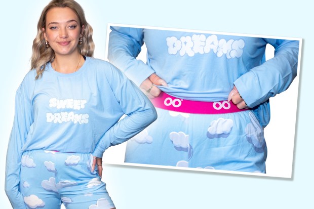 Sun Shopping writer Lucy Powell tests Oodie's light blue pyjamas with cloud print and "Sweet Dreams" text.