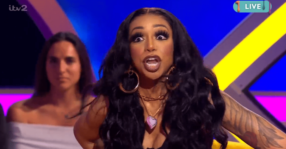 Tiffany Pollard on a live TV show, looking shocked.