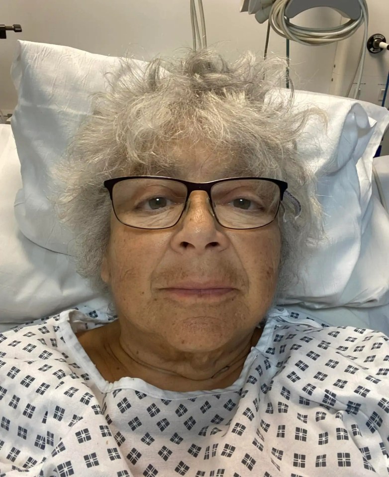 Miriam Margolyes in a hospital bed.