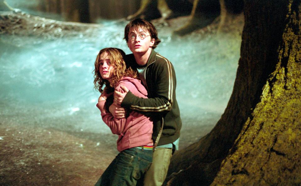 Harry Potter and Hermione Granger embracing in a scene from Harry Potter and the Prisoner of Azkaban.