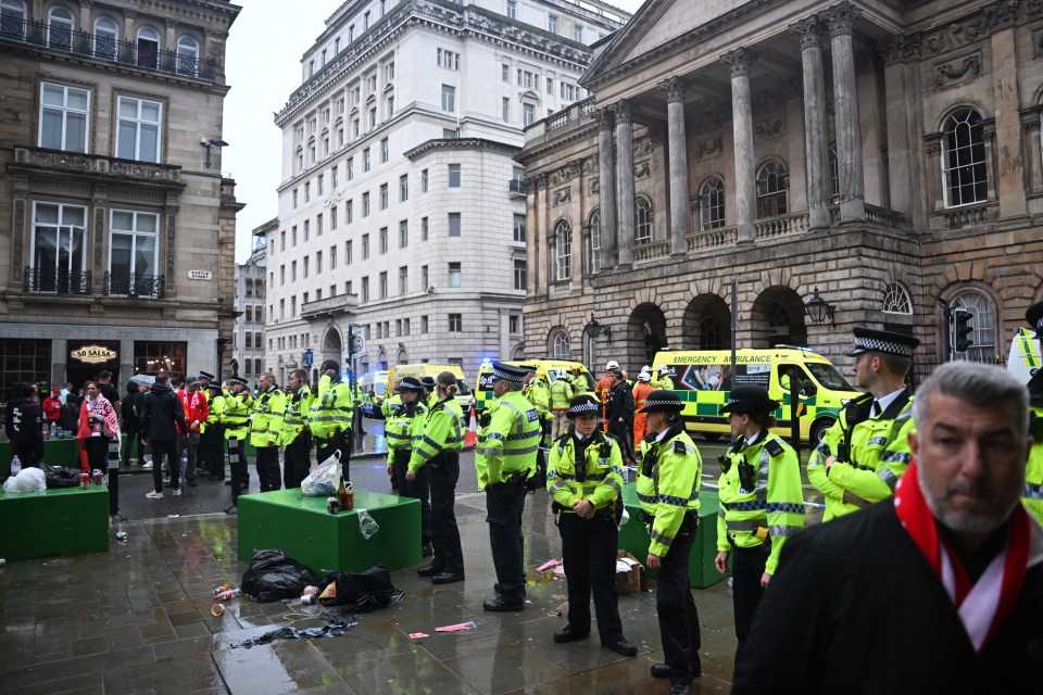 Police officers at a Liverpool Town Hall following a car collision.