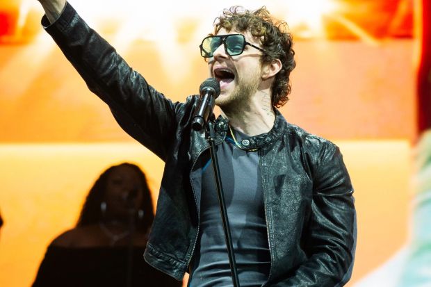 An image collage containing 1 images, Image 1 shows Tom Grennan performing at a concert