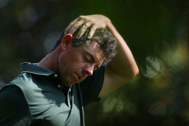 Rory McIlroy reacting to a golf shot.