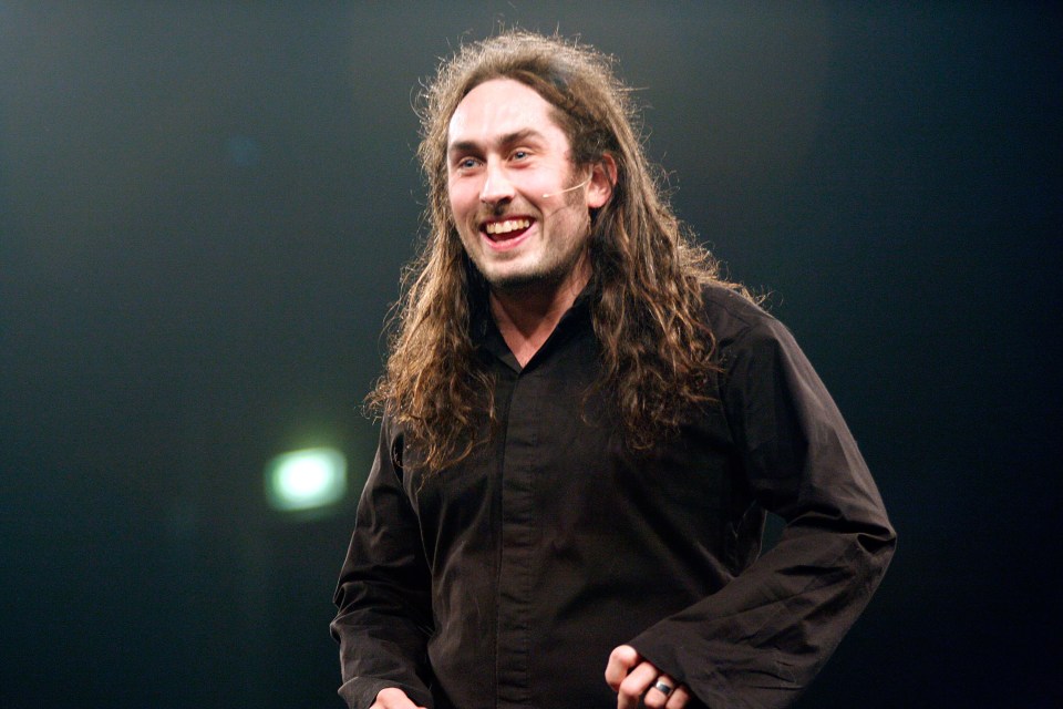 Ross Noble performing on stage.